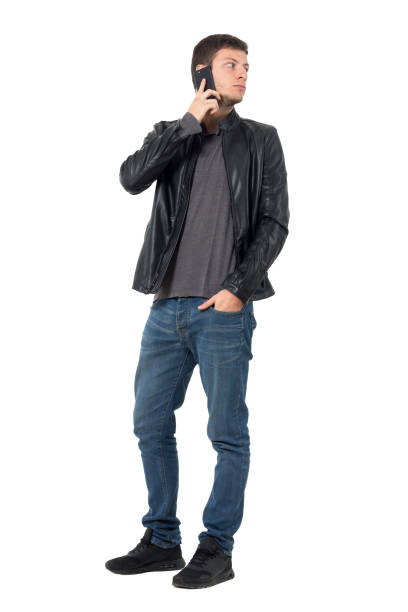 istock Casual man talking on the cellphone turn back looking behind 638560720