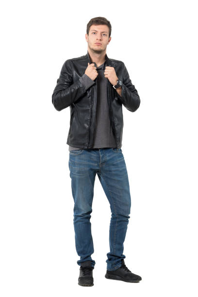 istock Casual man in jeans and leather jacket adjusting collar 638560834