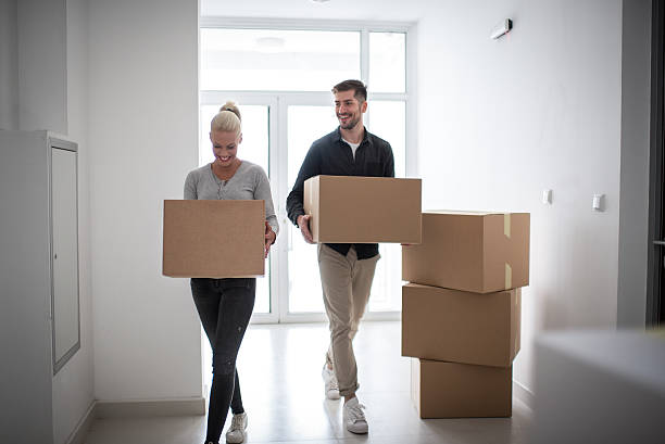 istock Couple moving into new apartment building 638561094