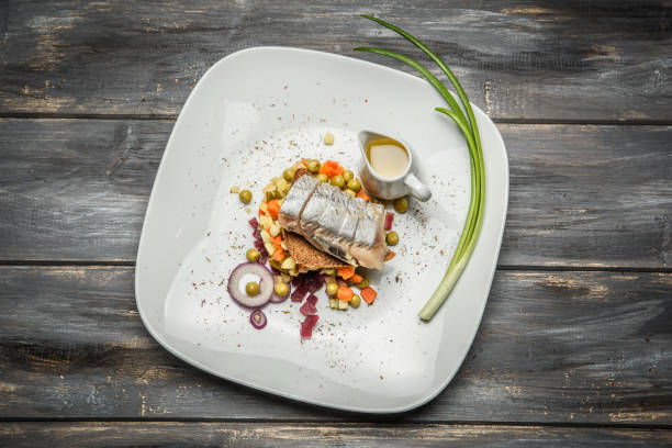 istock vegetable salad with herring olive oil on wooden background 638561180