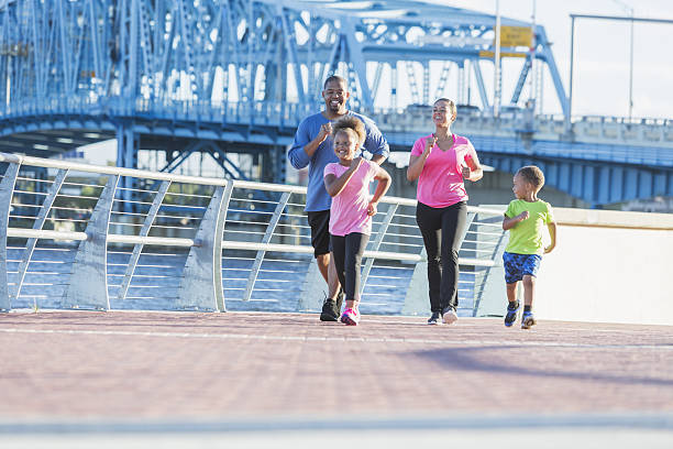 istock Black family staying fit, power walking on waterfront 638562846