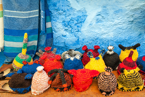 Colourful traditonal,funny wool caps; street market at Chefchaouen, Morocco,North Africa.Nikon