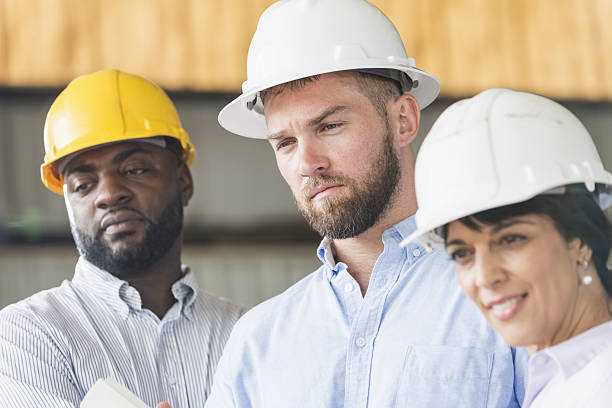 istock Group of workers wearing hardhats 638564546