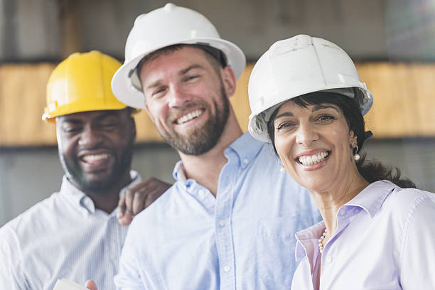 istock Group of workers wearing hardhats 638564602