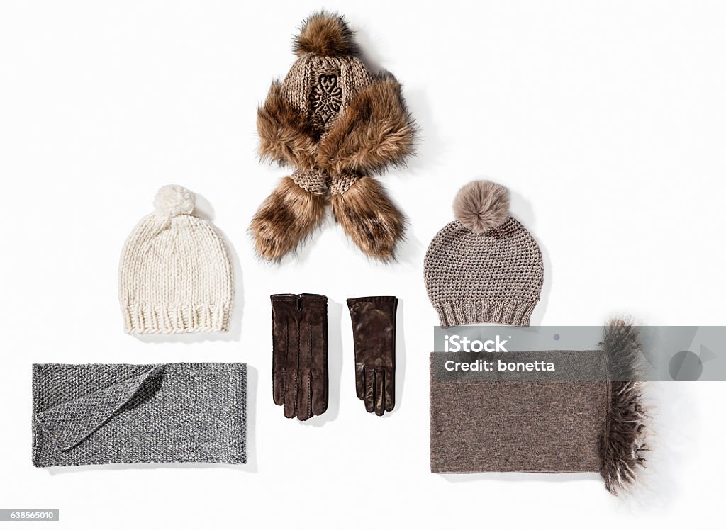 Warm winter knitted clothes - hat, scarf, gloves Warm winter knitted clothes - hat, scarf, gloves isolated on white background ( with clipping path) Glove Stock Photo