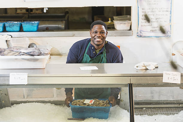 istock Black man working in seafood market 638565634