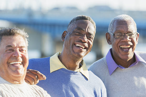 istock Faces of three multi-ethnic senior men laughing 638565674