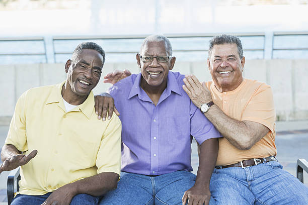 istock Three multi-ethnic senior men on bench outdoors 638565730