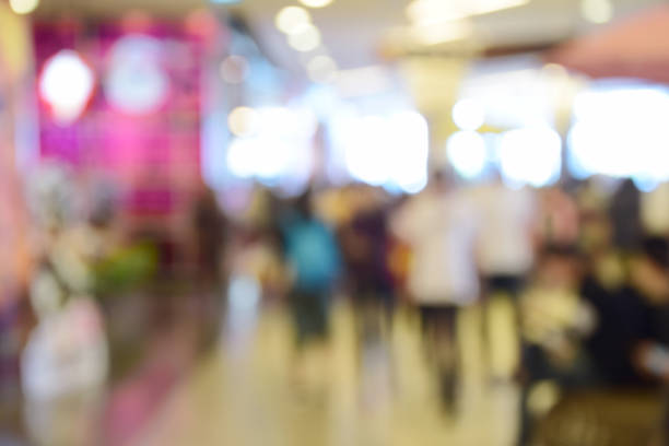 istock blurred image abstract people walking in shopping centre. 638566368