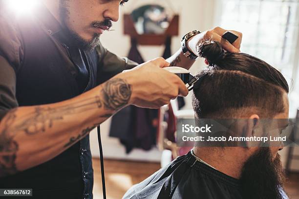 Man Getting Trendy Haircut In Barber Shop Stock Photo - Download Image Now - Cutting Hair, Machinery, Men