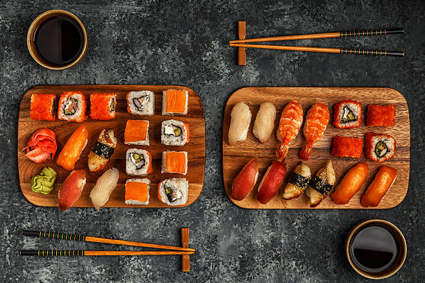 istock Sushi Set: sushi and sushi rolls on wooden plate. 638567992