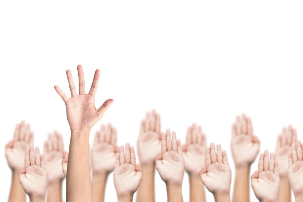 istock business crowd raising hands, many hands raise high up 638568360