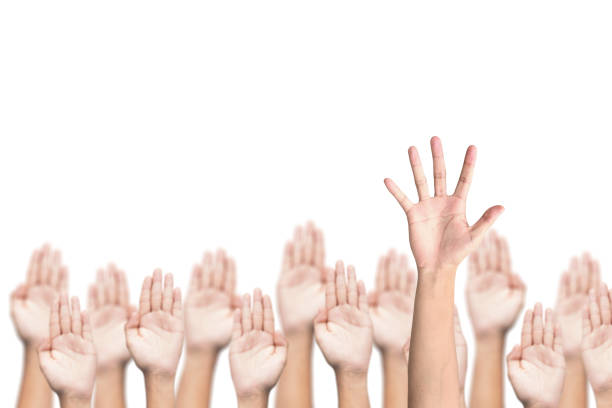 istock business crowd raising hands, many hands raise high up 638568396
