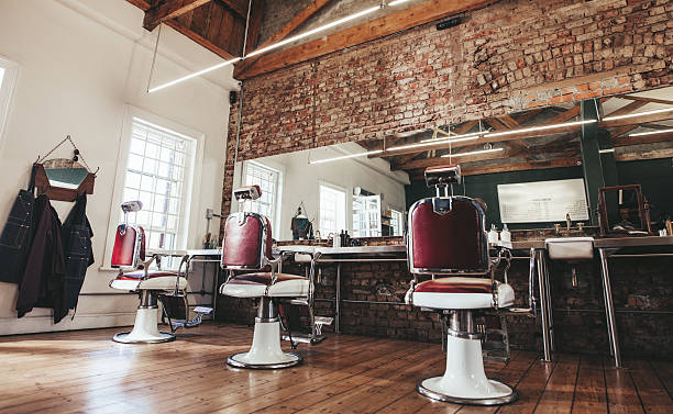 Retro styled barbershop. Horizontal shot of empty chairs in retro styled barbershop. Hair salon interior. jacob ammentorp lund stock pictures, royalty-free photos & images