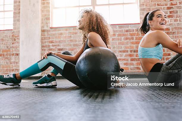 Young Women Taking A Break From Workout Stock Photo - Download Image Now - Exercising, Weekend Activities, Friendship