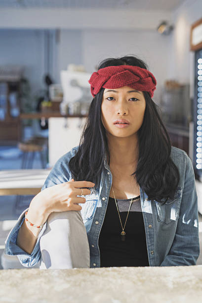 istock Attractive Asian female hipster sitting cafe 638570528