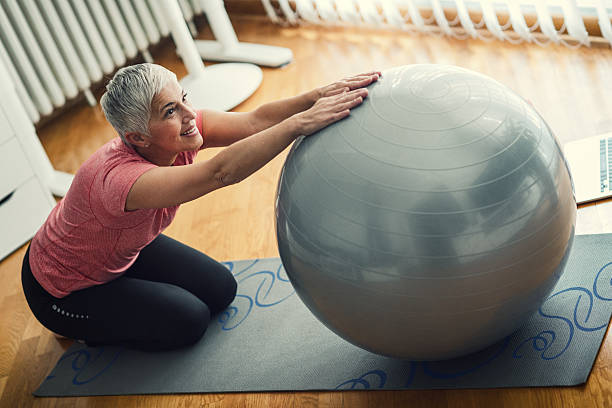 istock Mature Woman Exercise At Home. 638571894