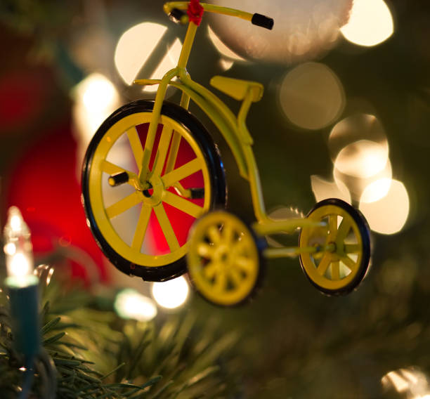 istock Yellow Tricycle Christmas Ornament on the tree 638572960