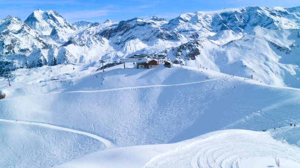 istock Alps snowy peaks panorama with skiing pistes 638573318