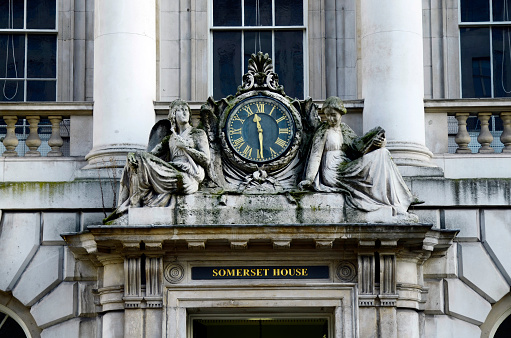 London, United Kingdom - January 16, 2016: Clock and sculptures over entrance to Somerset House
