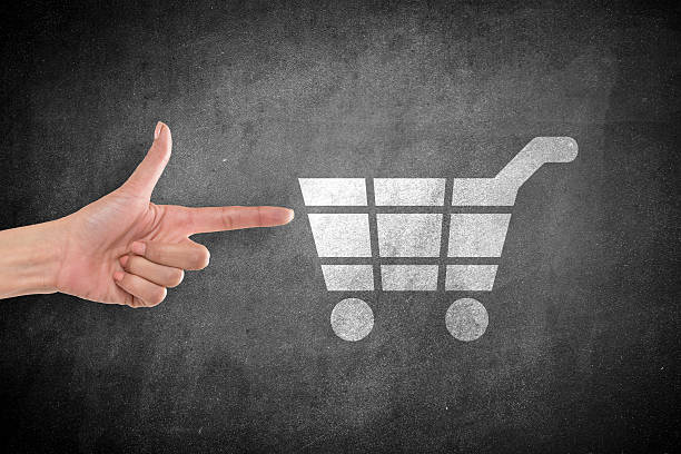 istock Hand pointing at shopping cart icon 638574104
