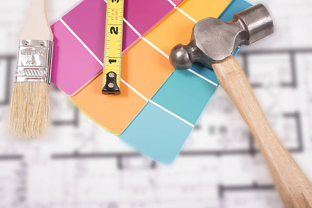 istock Painting, DIY construction tools lie on home blueprints, plans. 638574286