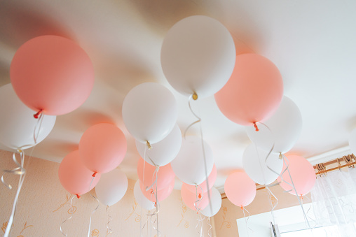 Colorful balloons in room prepared for birthday party.