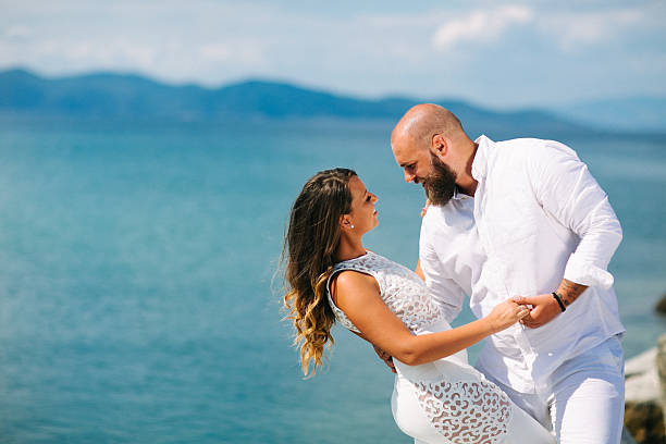 Young Romantic Couple Playing on the Beach
