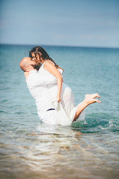 istock Young Romantic Couple Playing on the Beach 638578248