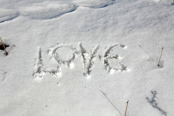 istock text love on a background of fresh snow 638578314