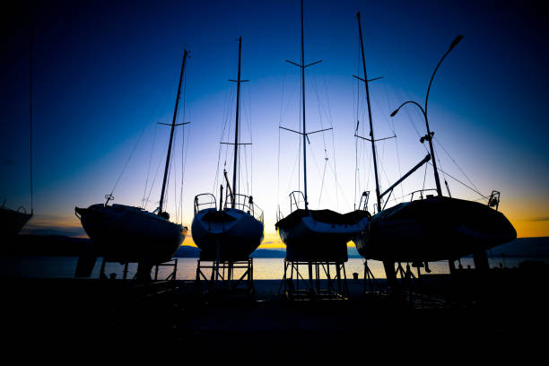 sailboats at dry dock sunrise view - repairing sky luxury boat deck imagens e fotografias de stock