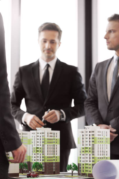 istock Business people and apartment house model 638581018