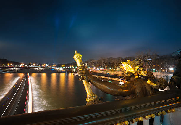 Pont des Invalides In the night illumination . Night view of Seine river and bridge in Paris