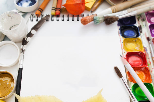 istock Blank sketchbook with dye and paintbrushes mockup 638584690
