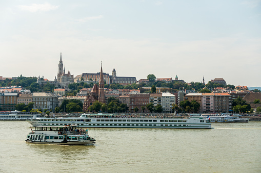Budapest, Hungary - August 19, 2016: transportation ships into the danube in front of Fisherman's bastion in Budapest