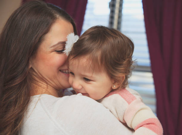 istock Mother embracing her  daughter 638587520