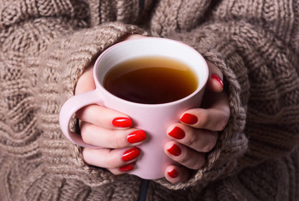 istock Tea in woman hand 638589822