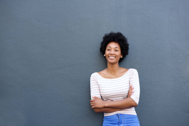 istock Confident woman smiling with arms crossed 638591820