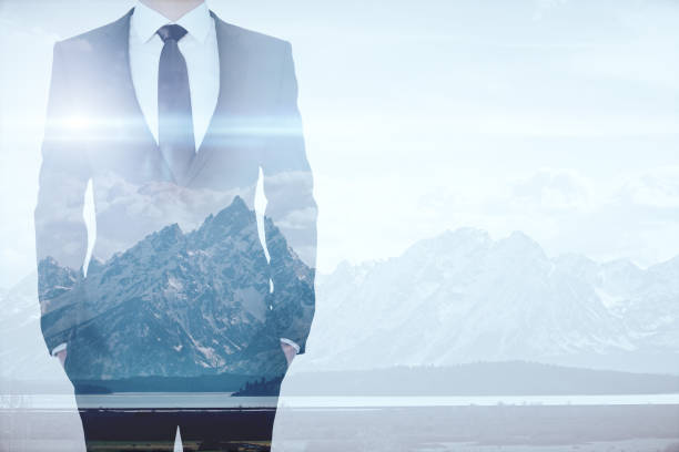 istock Businessman on mountains background multiexposure 638592454