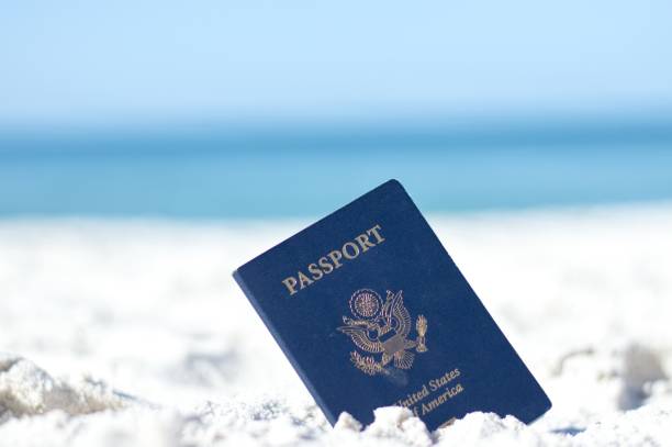 istock American Passport in the Sand at the Beach 638592946