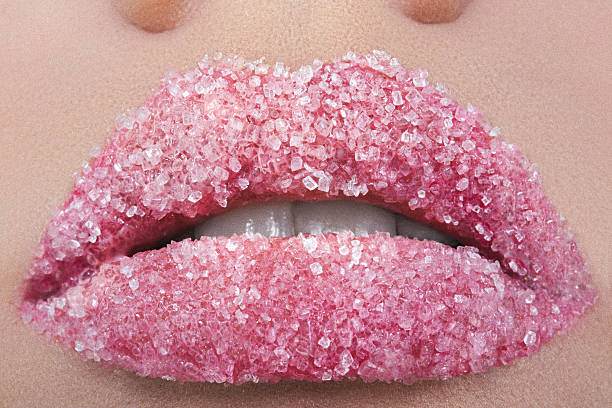 istock Female lips sprinkled with sugar 638593520