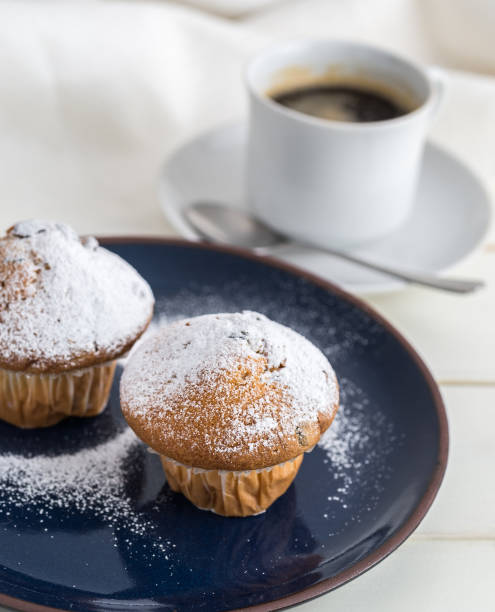 istock Breakfast with muffins by powdered sugar and coffee. 638594818