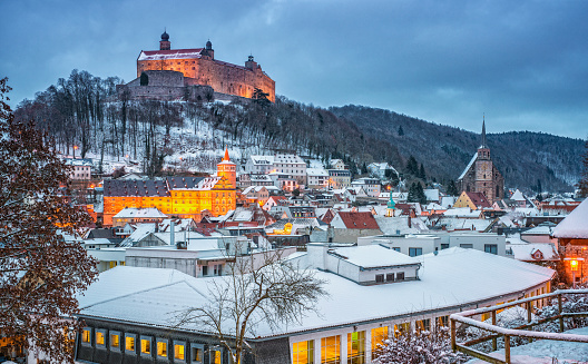 View over the historic medieval city of Kulmbach covered under fresh snow at dusk