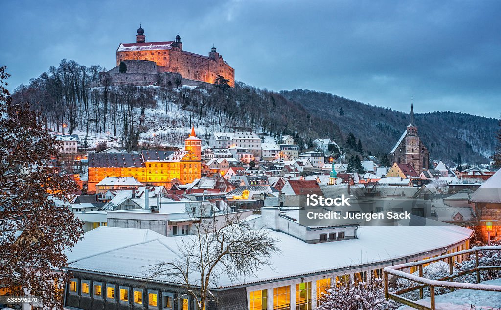 Kulmbach in Winter at dusk View over the historic medieval city of Kulmbach covered under fresh snow at dusk Winter Stock Photo