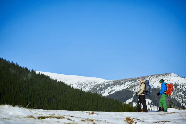 istock hikers in the winter mountains 638599470