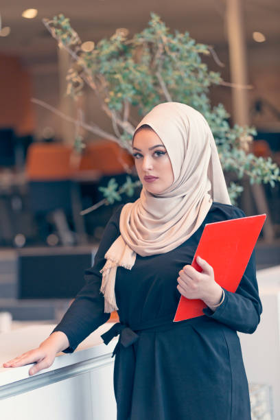 istock Arabian business woman holding a folder in modern startup office 638599962