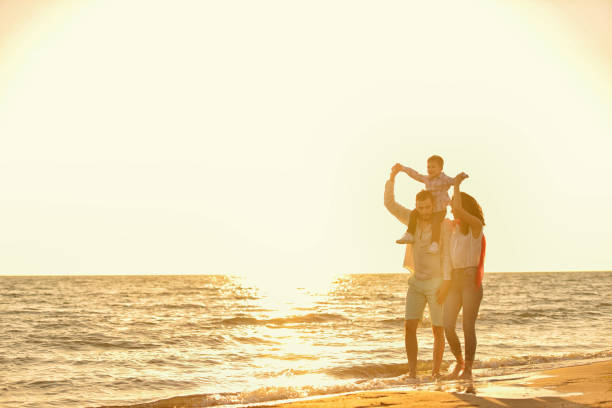 istock happy young family have fun on beach 638600842