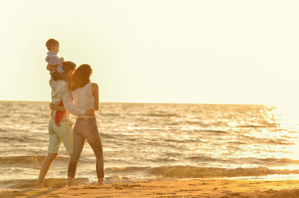 istock happy young family have fun on beach 638601034