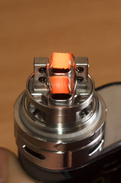 istock vape, ecigarette atomizer on wooden background 638601394
