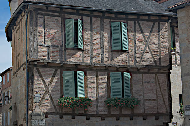 half-timber house in France with green shutters